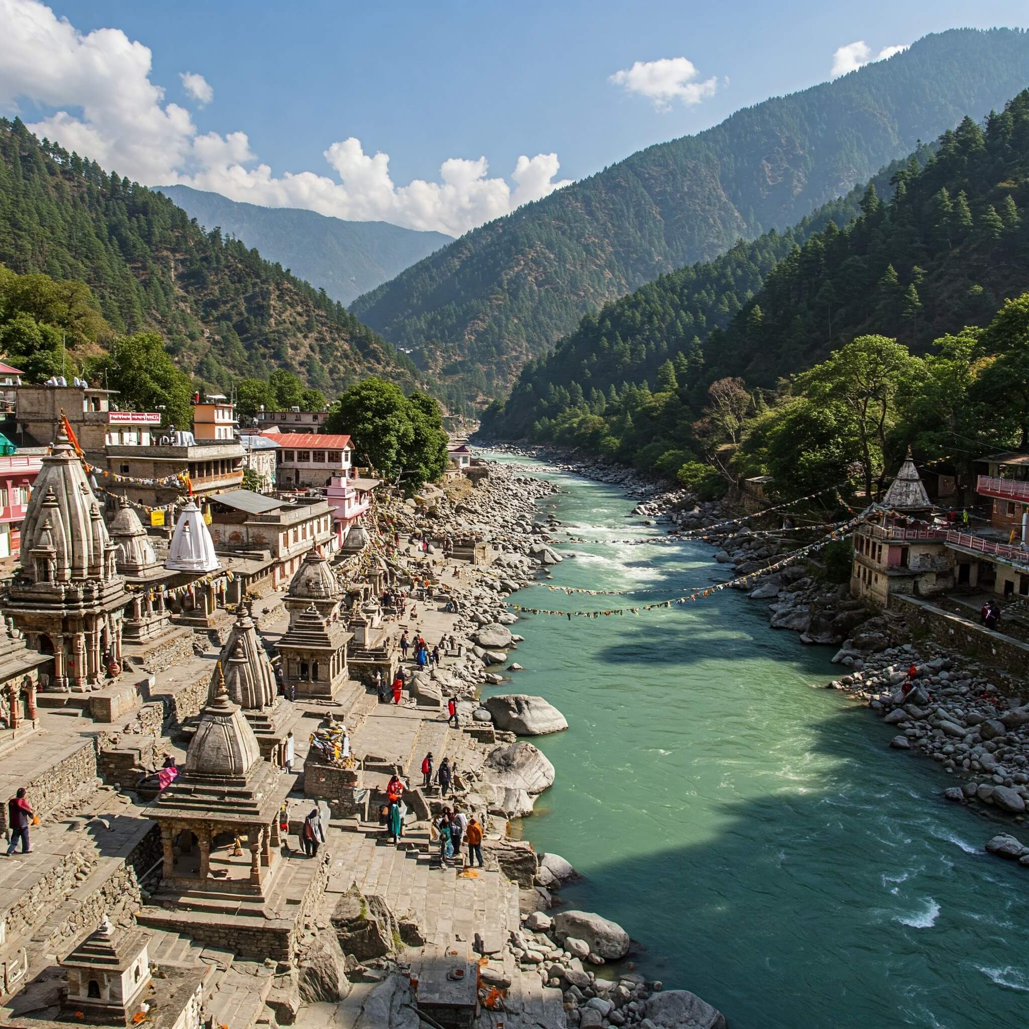 Sacred confluence of Hanuman Ganga and Yamuna rivers with mountain backdrop and small temples